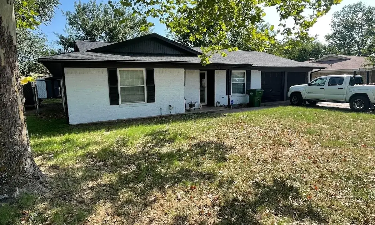 Professional roofing crew working on a residential roof in Richland